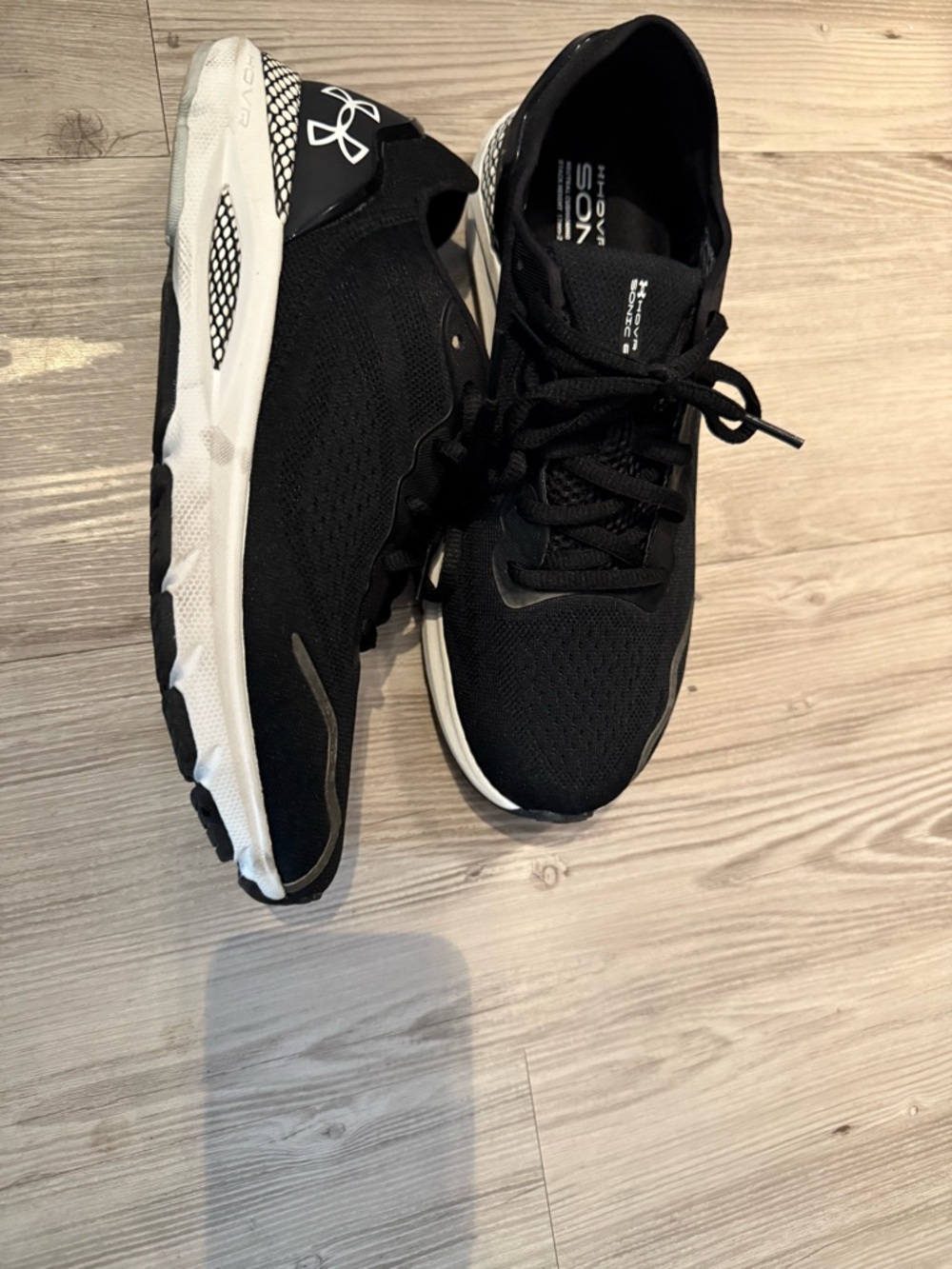 Under Armour women’s Black and White Athletic Running Shoes